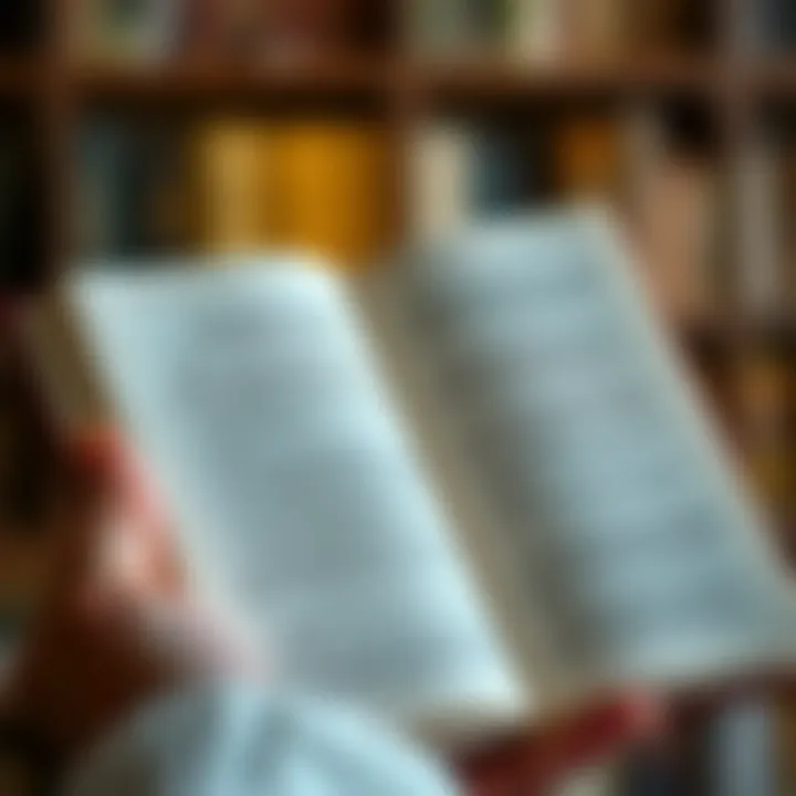 A close-up of a hand holding a book with inspirational quotes