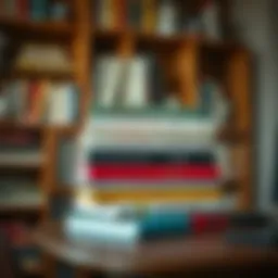 A stack of influential finance books on a wooden desk
