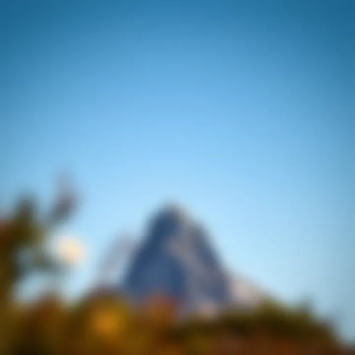 Majestic Isolation: Embracing Solitude A solitary mountain peak against a clear sky