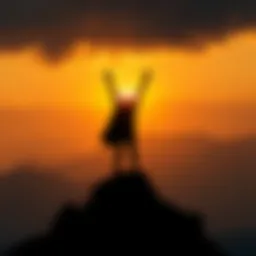 A silhouette of a figure standing atop a mountain, arms raised in triumph