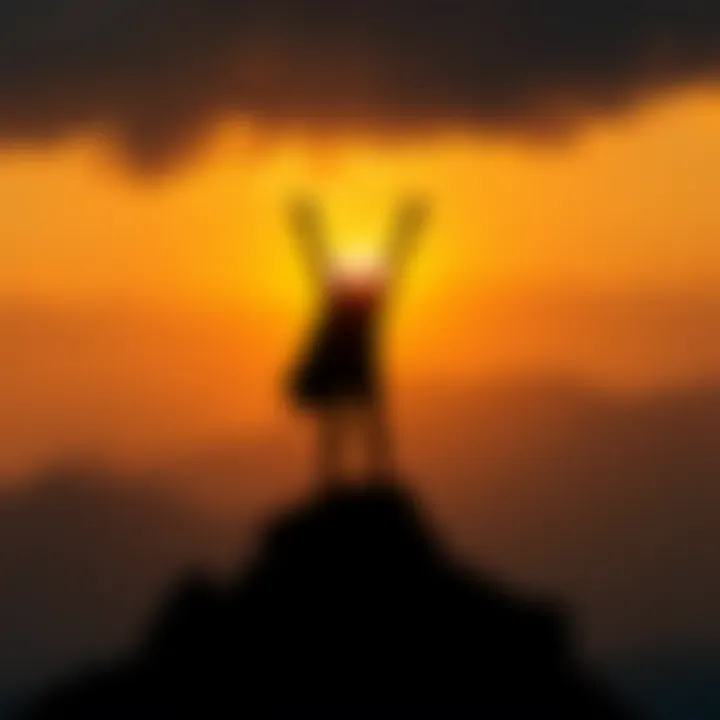 A silhouette of a figure standing atop a mountain, arms raised in triumph