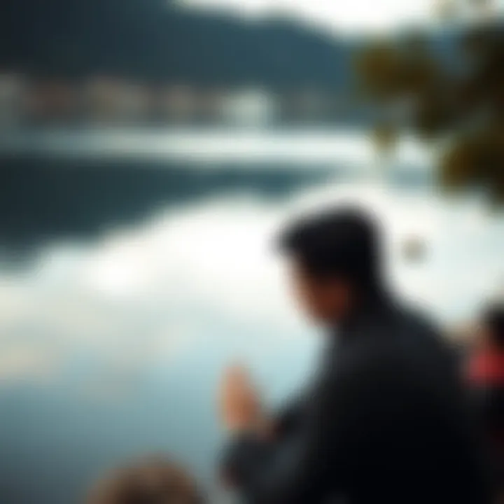 A person reflecting near a calm water body