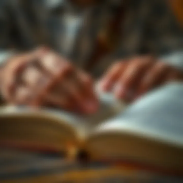 A close-up of a person's hands turning the pages of a book